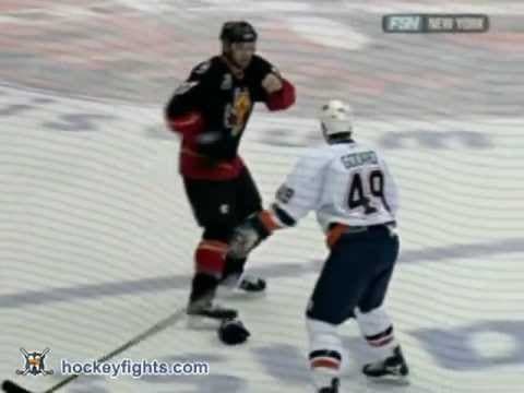 C. Simon (CGY) vs. E. Godard (NYI)